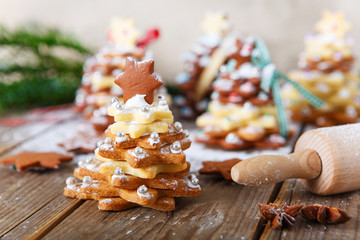Homemade baked Christmas gingerbread tree on vintage wooden back