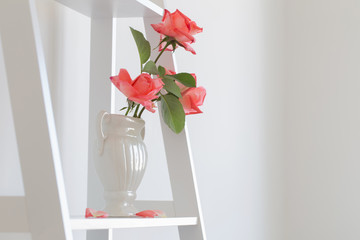  bouquet of roses in vase on white background