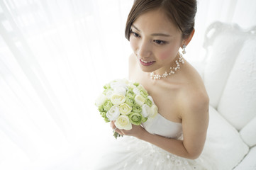 Bride is waiting for a groom in the room