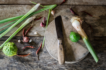 Herb and spicy ingredients of thai food on wooden background in