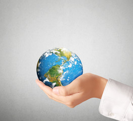  global in hands.Ecology concept. Elements of this image are fur