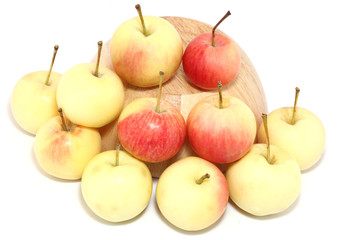 apples on wooden cup.