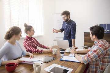Fototapeta premium Workers gathered in the conference room