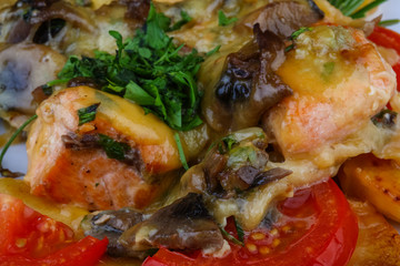 Roasted salmon with potato and tomato