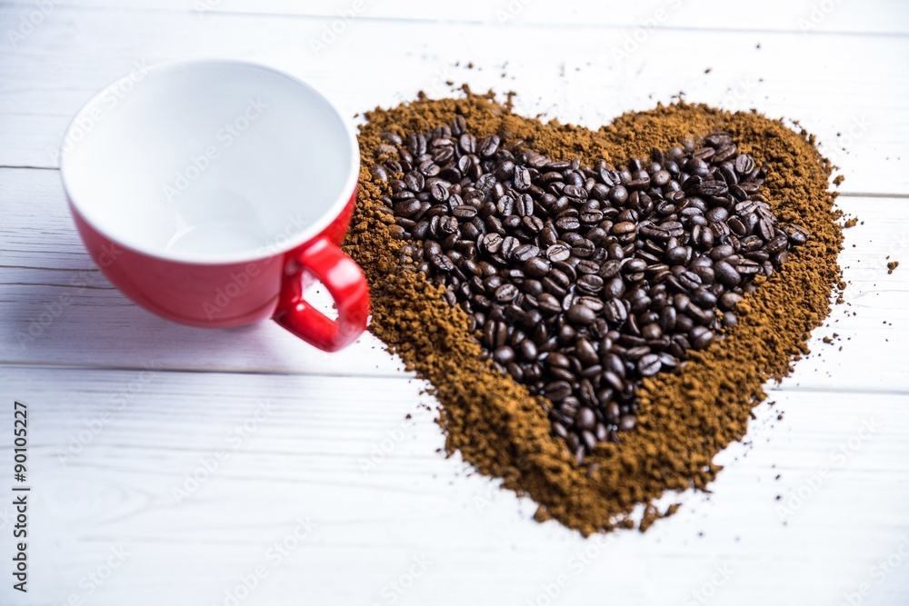 Poster coffee on a table in heart shape with cup