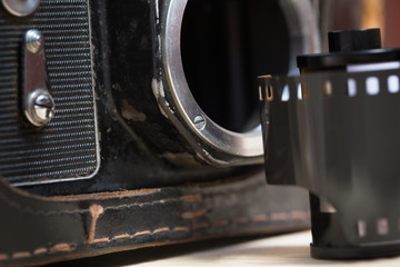 Old vintage photo camera with film.