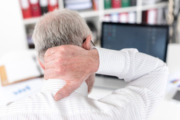 Fototapeta premium Businessman suffering from neck pain