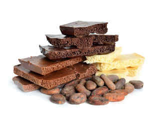 Black, white, milk air chocolate with Cocoa beans before roast