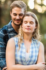 Fototapeta premium Happy smiling couple embracing with eyes closed