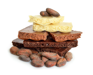 Black, white, milk air chocolate with Cocoa beans before roast