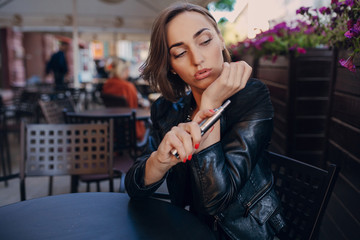 beautiful glamorous brunette smoke electronic cigarette