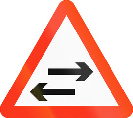 Bangladeshi sign warning about two-way traffic on a two-way road