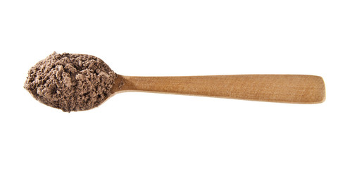 cinnamon powder in a spoon