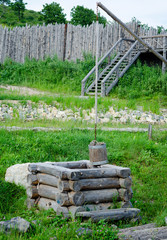 Old draw well with wooden bucket