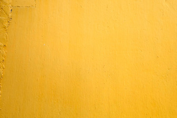 Yellow paint concrete wall texture background
