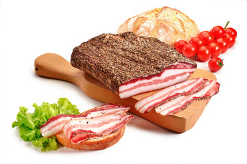 Cutting board with bacon and bread
