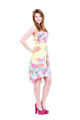 Beautiful young happy woman in light dress.