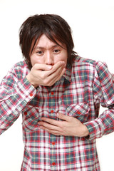 吐きそうな男性