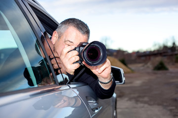 Obraz premium Man photographed from the car