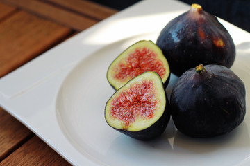 Fresh figs on wooden table