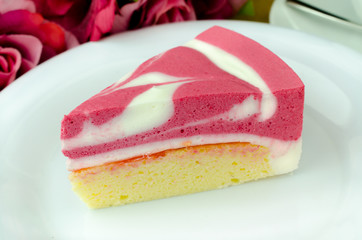 Raspberry yogurt cheese cake on white plate 