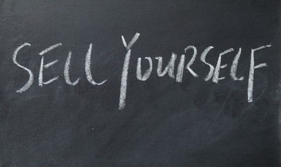 Fototapeta premium sell yourself text write on blackboard