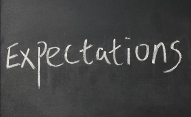 expectations word write on blackboard