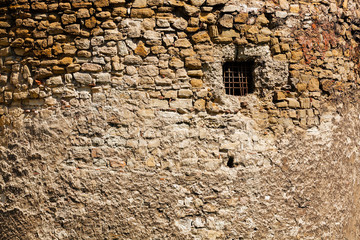 old stone wall with window