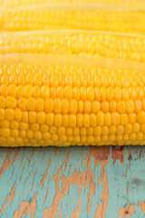 Corn cob on rustic wooden table