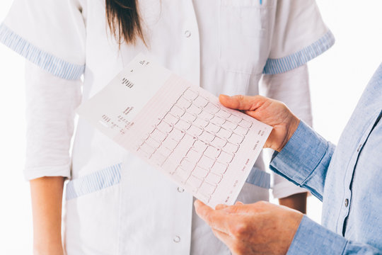 Patient holding cardiogram