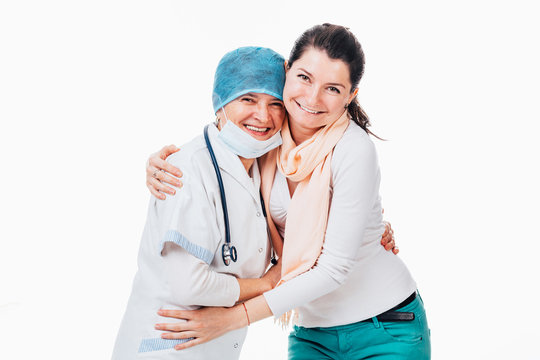 Happy Patient Hugging Senior Doctor