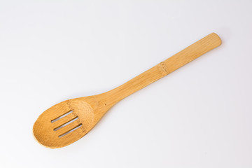 Used slotted wooden spoon