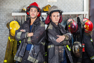 Fototapeta premium Confident Firemen Standing Arms Crossed