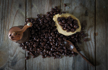 Turkish coffee grinder lay on coffee bean