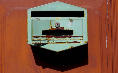 Old-fashioned mailboxes on the stucco wall