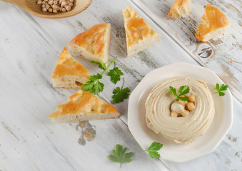 Plate of  Healthy Homemade Creamy Hummus with pita.