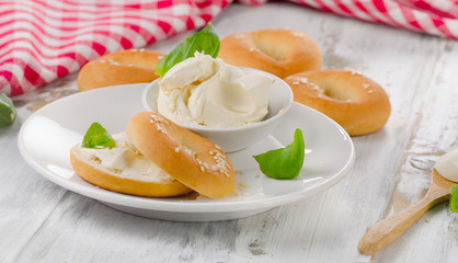 Fototapeta premium Bagels with cream cheese for a breakfast.