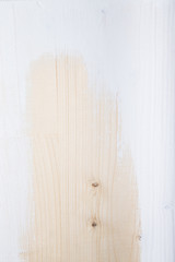 Part of the board with knots and white paint. Selective focus. v