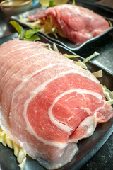 Slice Pork on black dish