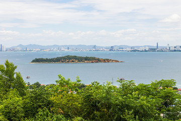 A view of small island, Pattaya city in background
