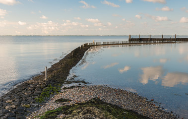 Fototapeta premium Breakwater in a small harbor