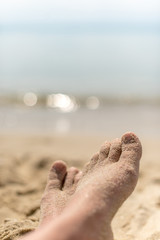 sandy feet on the beach