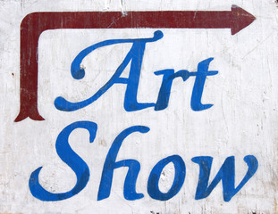 aged and worn art show sign with arrow © jdoms