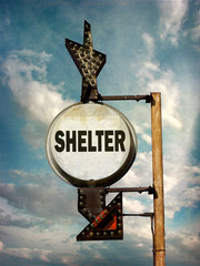 aged and worn vintage photo of shelter sign
