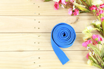Color belt of martial art on wood floor