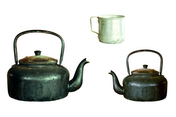 Old aluminium kettle and cup old-style retro isolated on white b