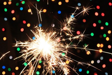 Fototapeta premium Celebrating background Sparkle bright confetti bokeh new year night festive 