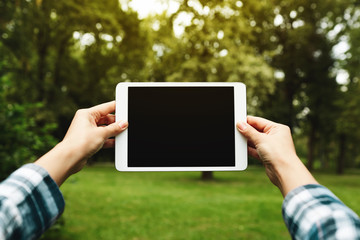 Tablet computer. Hipster woman using digital tablet computer PC.