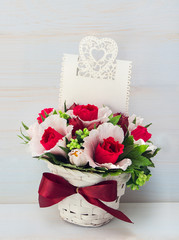 Decorative flower in a pot and gift with a card