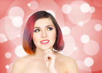 Beautiful smiling girl with colorful make-up on bubble background.